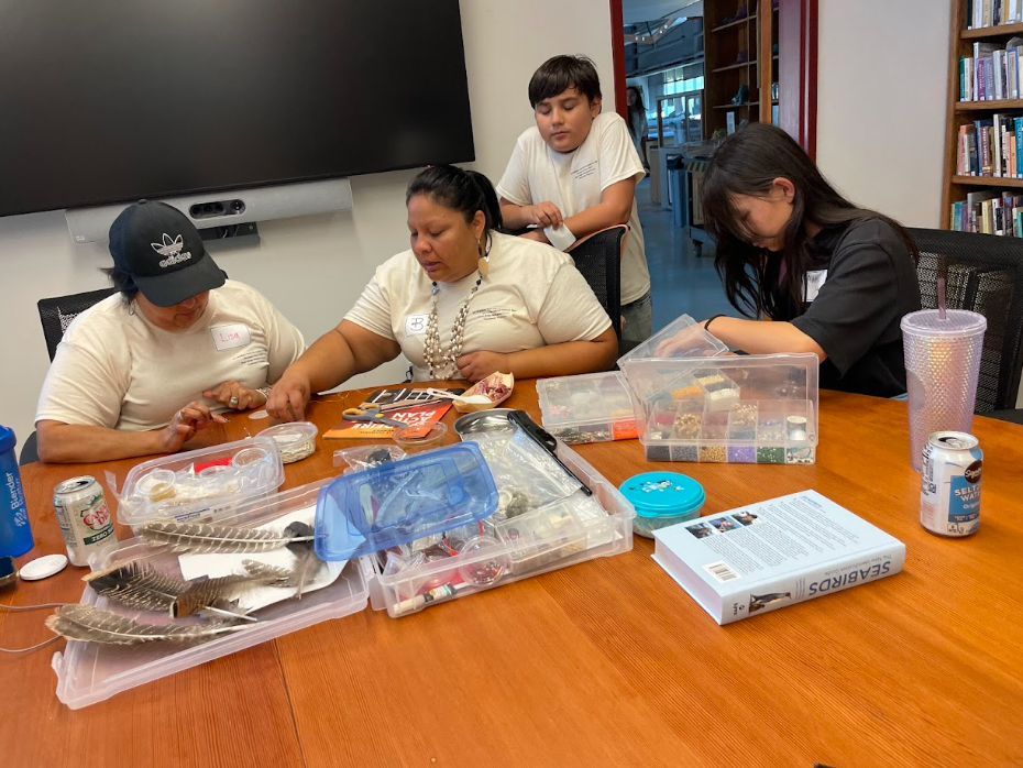 Tribal member Bernadette Quiroz and her son Maddox offered a beading class in the field station’s library. Photo by Tad Fukami.