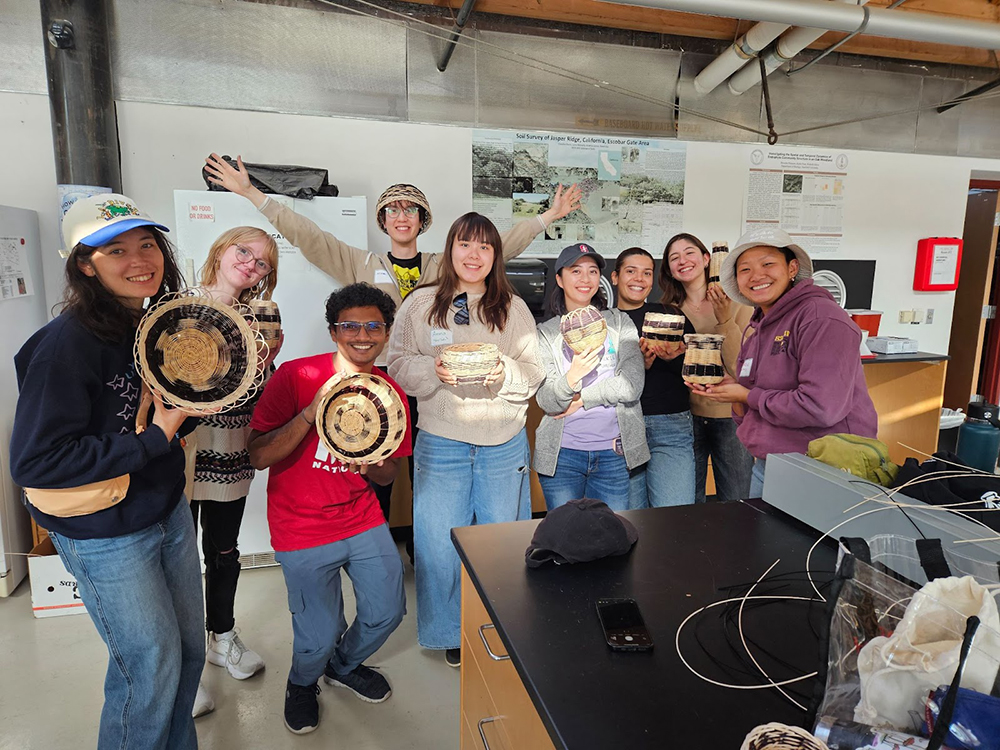 A group of graduate and professional students show their basket creations (photo by Katie Glover)