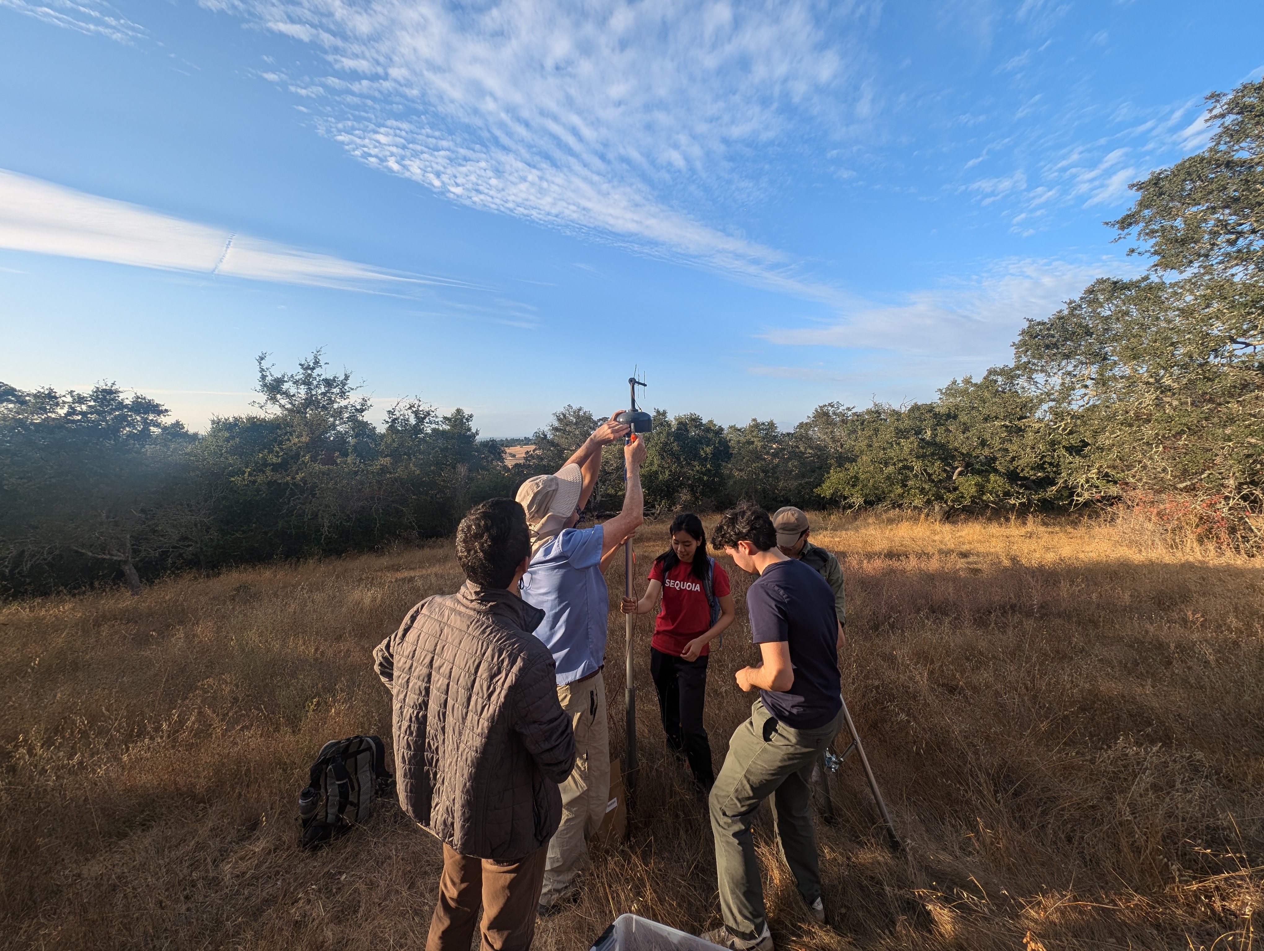 Members of the Stanford Smoke Mesh (SMesh) network install a PM2.5 sensor that will transmit data through radio waves