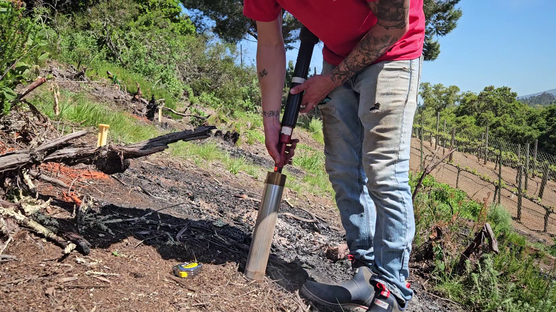 Adrian Wackett sampling soil cores with a slide hammer