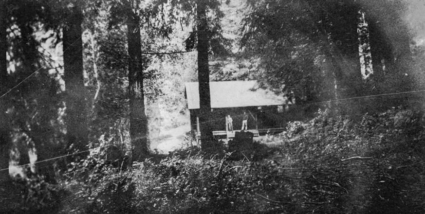 Photograph dated 1925 of the Zoology Cabin from an album of Herb Dengler.  The back of the photo states “Phil Christensen took this of Tony Morse and me (Tony on right).  H.J.D.”  
