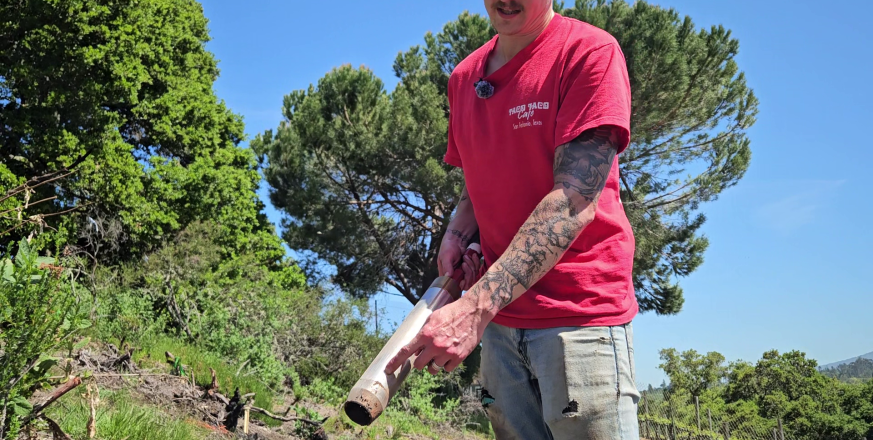 Adrian Wackett sampling soil cores with a slide hammer