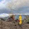 pile burning with fire technician